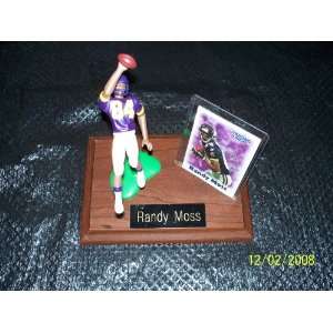 Randy Moss #84 Minnesota Vikings Football Figure on a wooden base with 