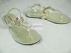 guess gold jinnie logo patent t stap sandals nwt one