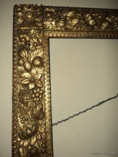   most frames and it is chock full of flowers fruit leaves and foliage