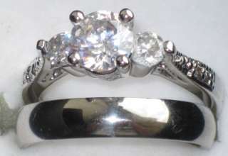  RING FEATURING 3 PRING SET SIMULATED DIAMONDS THE LARGEST GEMSTONE 
