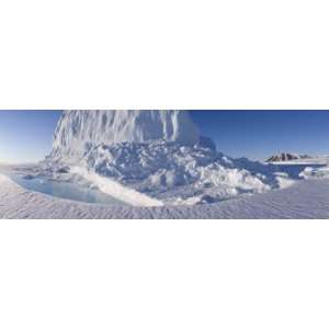 Iceberg with the Midnight Sun on the Left and Coburg Island on Right 