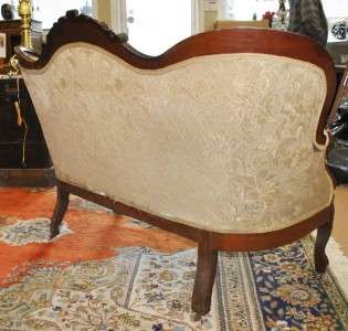 ON ITEM# 12JJ69.A FINGERED CARVED SETTE. FABRIC IS STAINED. THIS SETTE 