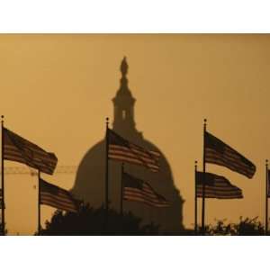 Twilight View of American Flags Flying Near the Capitol Building 