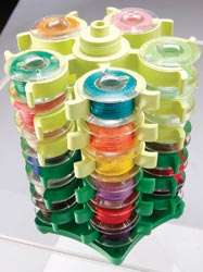 Neatly organize 30 bobbins. Holds any type of bobbin, secures threads 