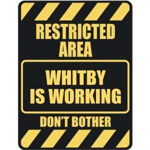   RESTRICTED AREA WHITBY IS WORKING  PARKING SIGN