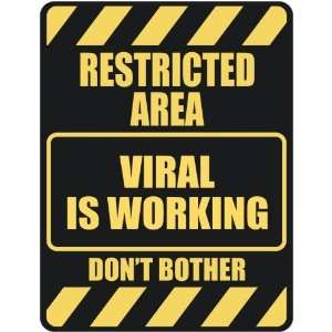   RESTRICTED AREA VIRAL IS WORKING  PARKING SIGN
