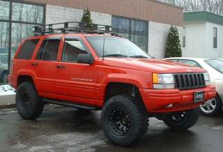 Angels 4.5 Rocky Road lifted ZJ on 32s with no fender cutting.