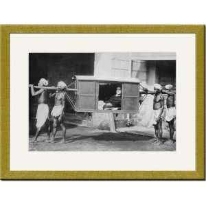   Indian Porters Carry a Westerner in a palanquin or