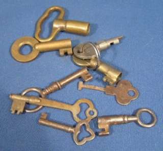  antique grouping of brass and cast iron keys. One of the brass keys 