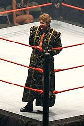 regal during his ring entrance wearing his traditional robe