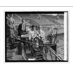   Harris & Griffith place wreath in chair of John Dugan, 6/16/25 Home