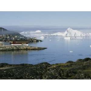 Icebergs from the Ilulissat Glacier Float by a Fishing Plant Premium 